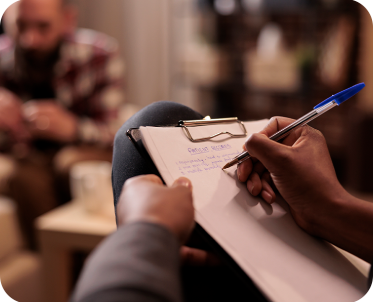male-psychologist-taking-notes-couple-therapy-session-help-with-relationship-issues-counselor-giving-advice-explaining-marriage-problems-using-paper-psychoanalysis-close-up